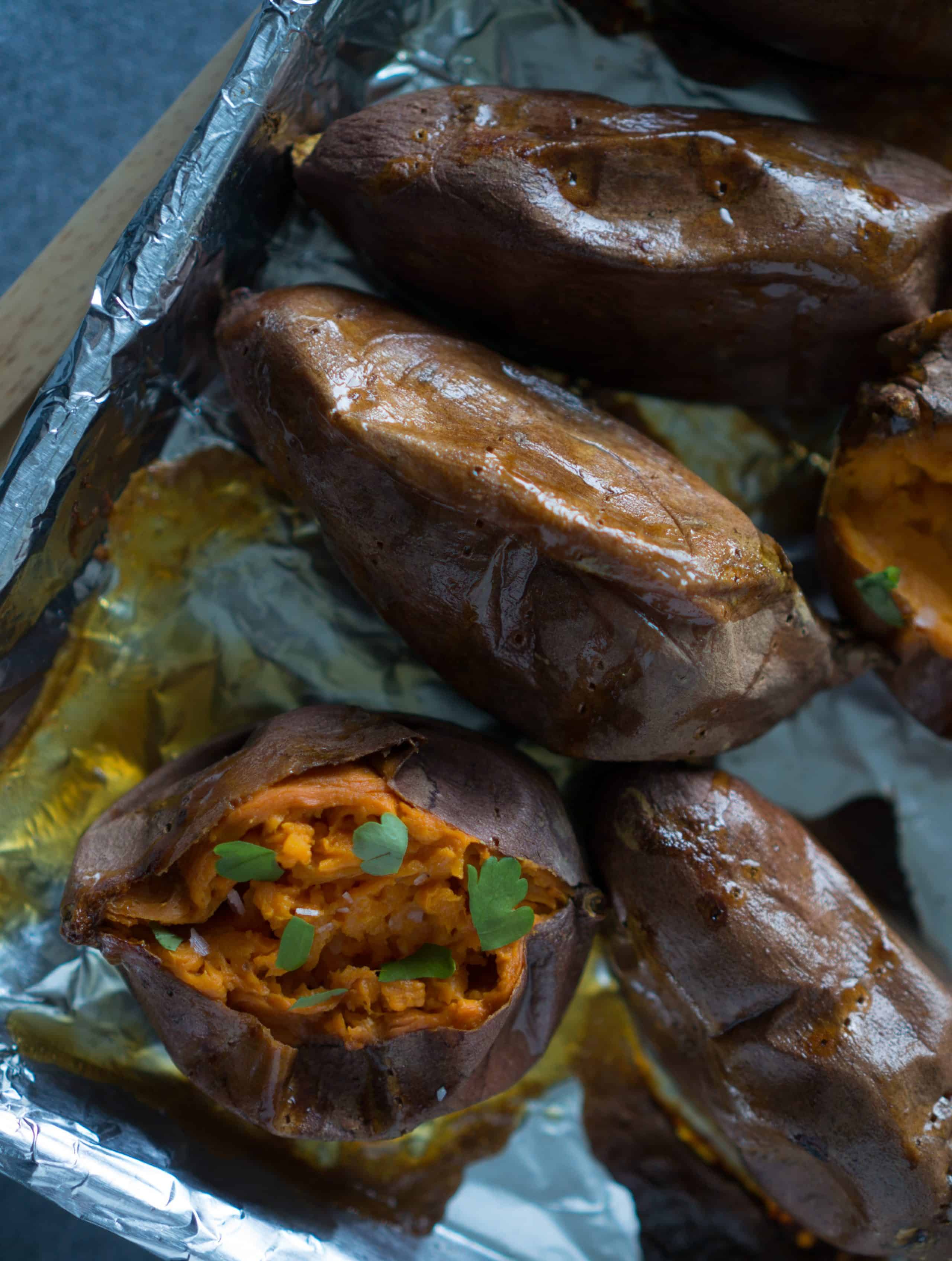 Slow Roasted Sticky Sweet Potatoes - We love this simple, vegan recipe for Slow Roasted Sticky Sweet Potatoes! Just 2 ingredients (olive oil + sweet potatoes) & a hot oven are all you need for perfectly caramelized sweet potatoes every time! | freeyourfork.com