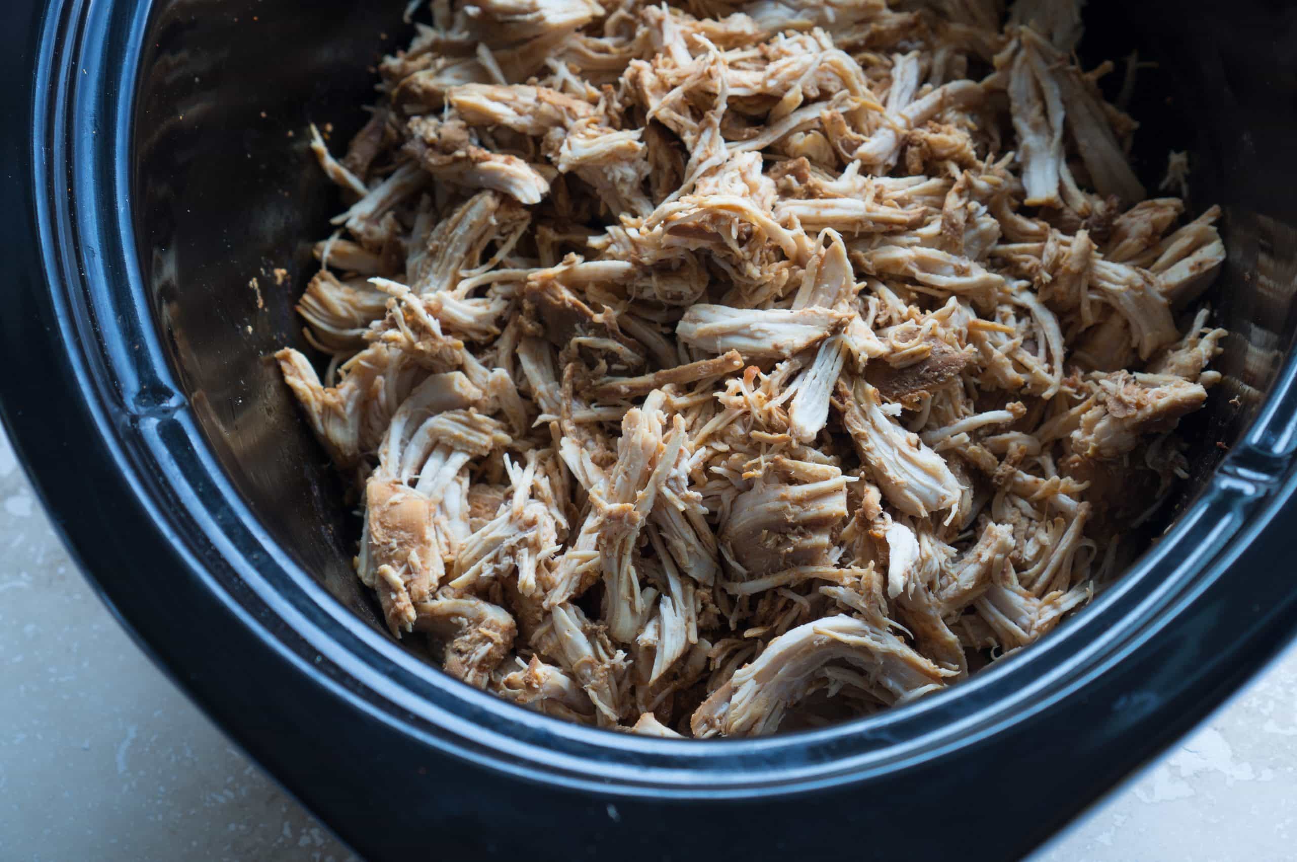 Easy Crockpot Pulled Chicken - This gluten-free recipe for Easy Crockpot Pulled Chicken is easy eats! Lean, protein-packed chicken breasts are made in the slow cooker with apple cider vinegar, tomato sauce, Worcestershire sauce, molasses, and smoked paprika. We love using this tender shredded chicken in enchiladas, tacos, lettuce wraps, sandwiches, and salads ♥ | freeyourfork.com