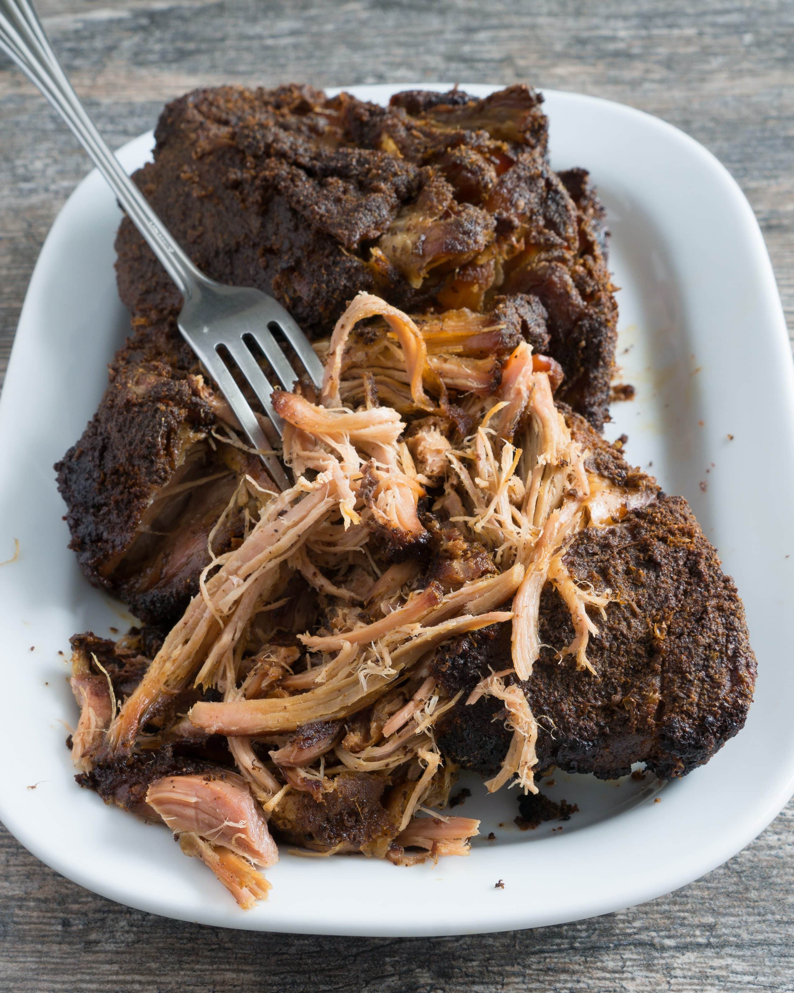 Crispy Crockpot Carnitas – Easy recipe for homemade Crispy Crockpot Carnitas. Gluten-free and paleo-friendly! Perfect for tacos, burritos, nachos, enchiladas, sandwiches, and more! Just combine pork shoulder with a simple dry-rub & a squeeze of citrus, then let your slow cooker do the rest. We love this on top of eggs for a quick, savory breakfast! ♥ | freeyourfork.com