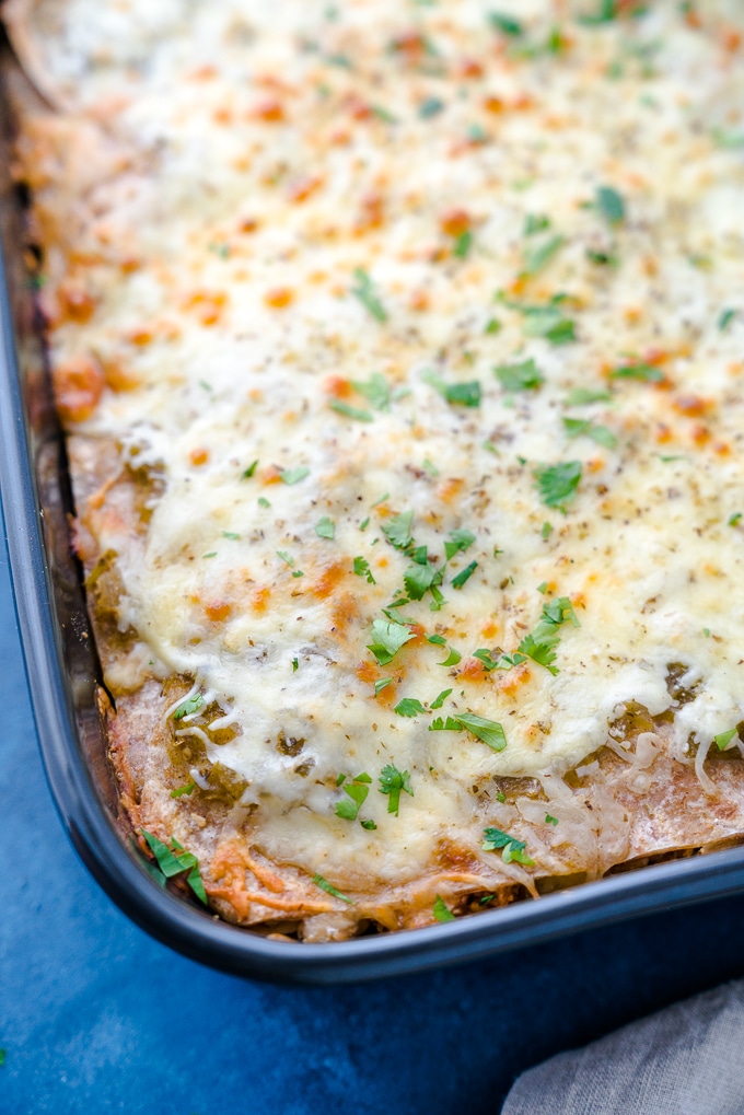 Green Chicken Enchilada Casserole - A healthy recipe for Green Chicken Enchilada Casserole! Baked in the oven with layers of soft tortillas, melty cheese, lean shredded chicken, white beans, salsa verde, and hatch chiles. Perfect for weekly meal-prep!! ♥ | freeyourfork.com