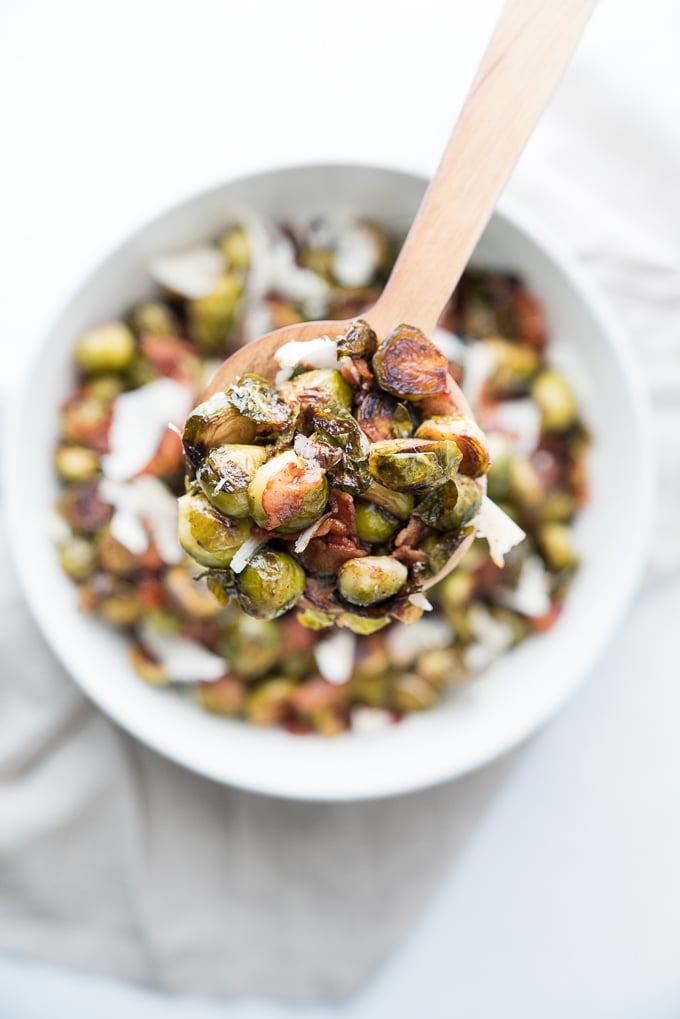 Easy recipe for Roasted Brussels Sprouts with Bacon + Parmesan! The perfect gluten free, vegetable side dish for your holiday table ♥ | freeyourfork.com