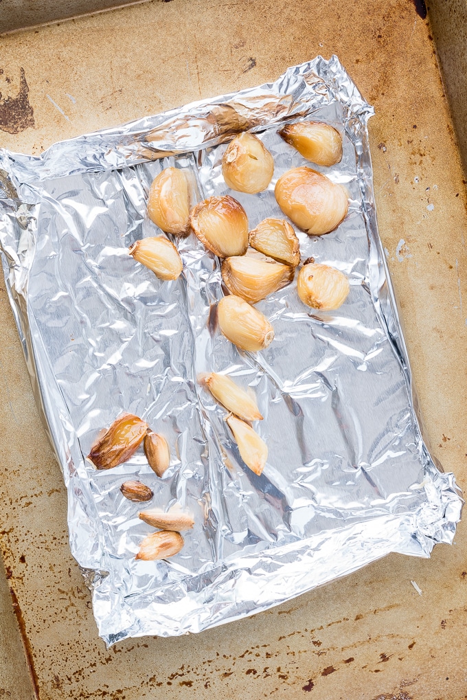 Quick Roasted Garlic Cloves - Simple and time-saving recipe! Roasted with just a drizzle of oil, individual cloves are roasted skin-on. Ready in under half the time, these are perfect for blending into soups, spreads, or sauces! ♥ | freeyourfork.com