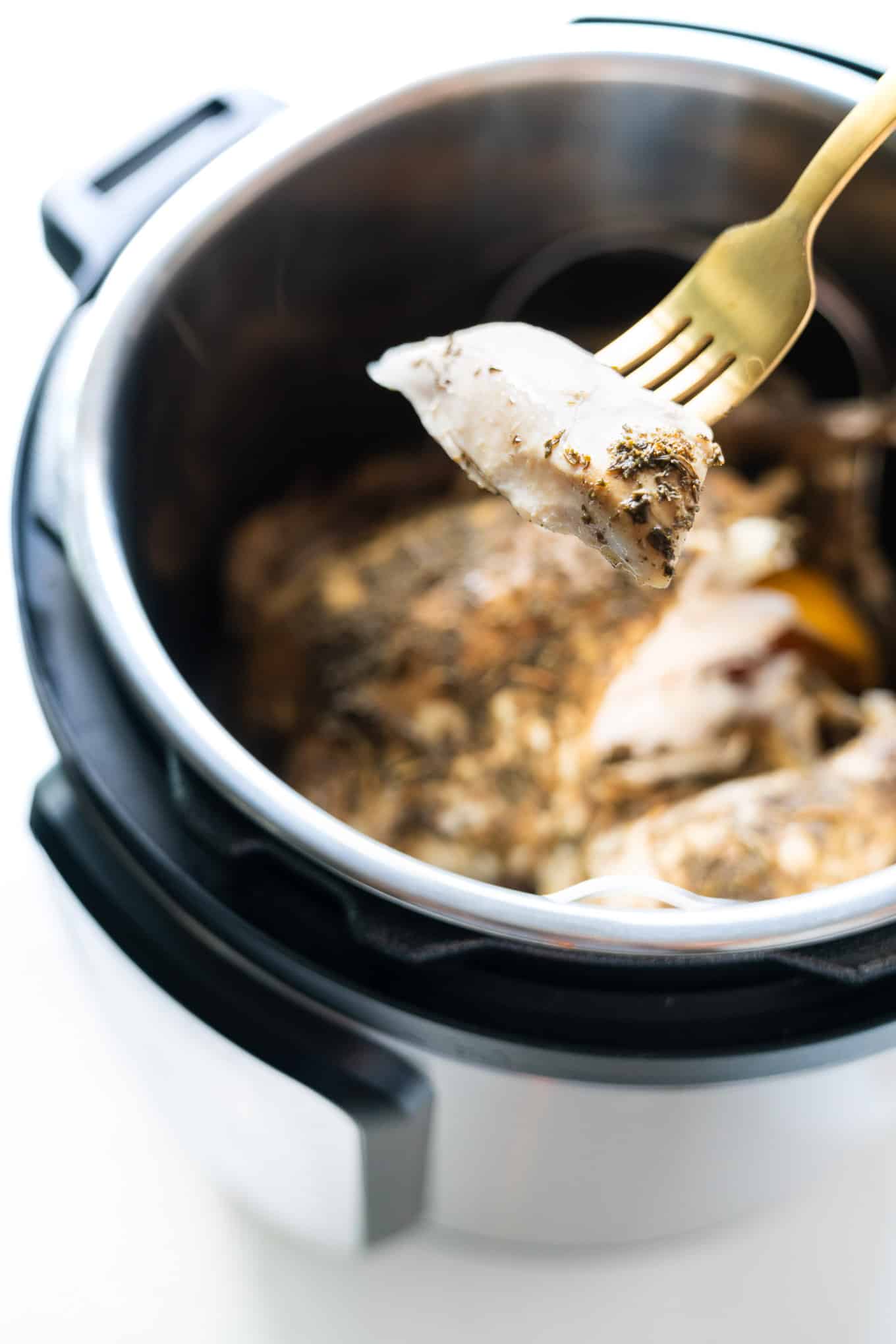 Instant Pot Whole Chicken with gold fork