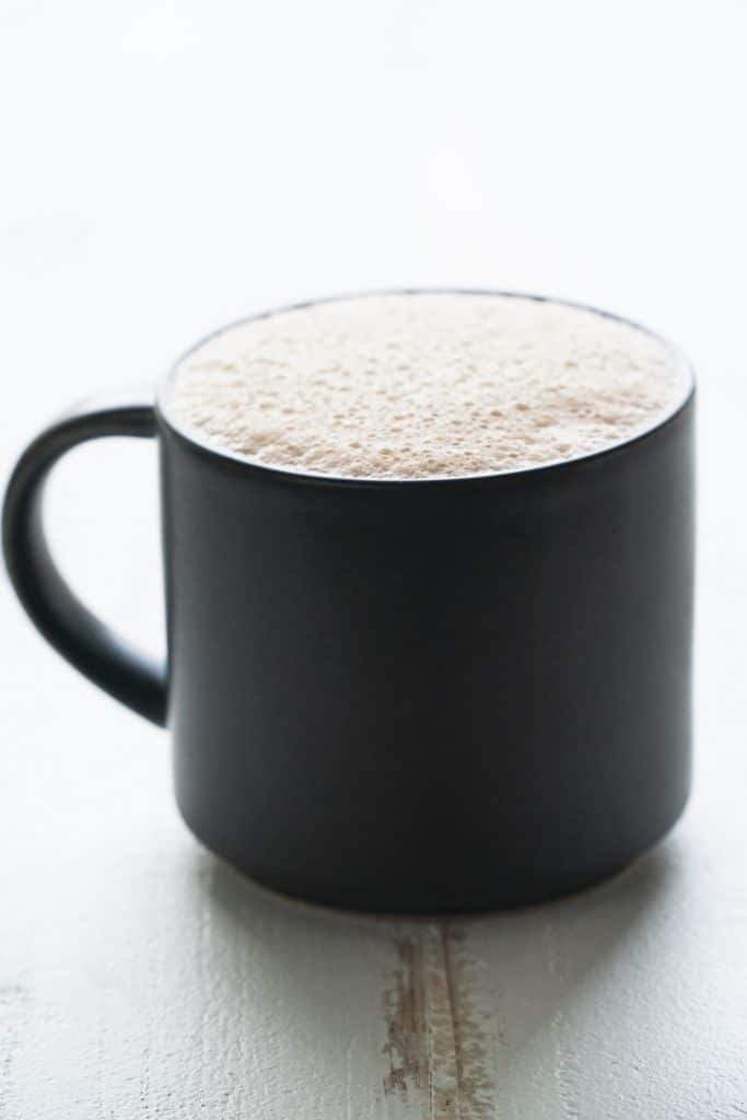 black mug of classic dairy free latte - free your fork